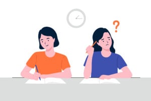 Two girl students writing in school. One girl is confused and struggling to write.