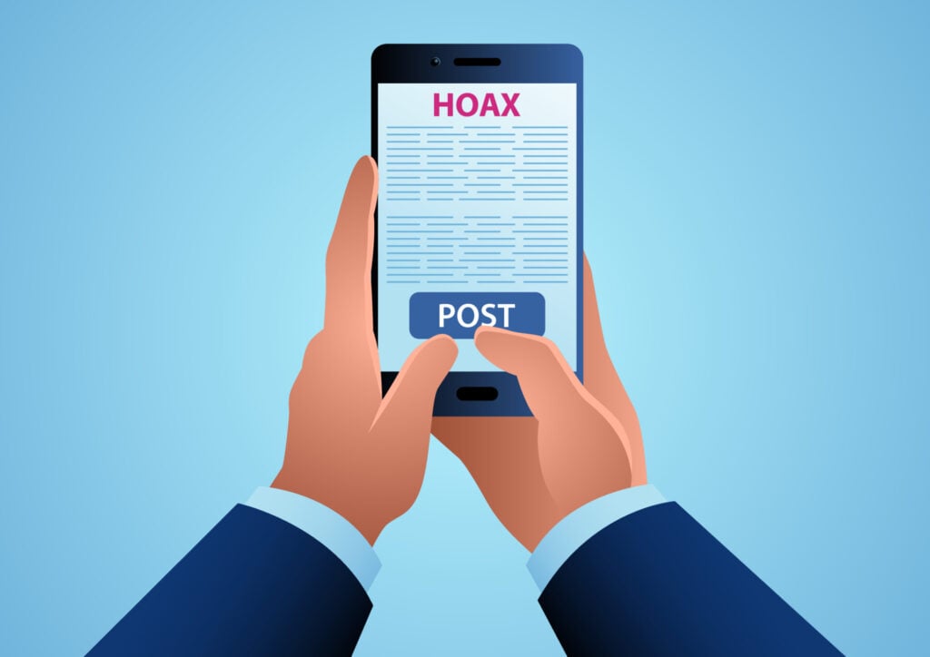What Is a Narcissistic Smear Campaign? 1 a man holding a smartphone about to post a written hoax