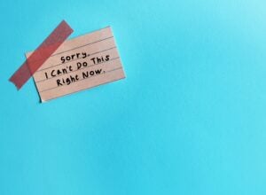 stick note on blue copy space wiith handwrtten text I’m Sorry - I Can't Do This Right Now - concept of people pleaser learning to say no politely instead of say yes to make too much commitment