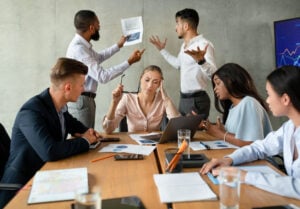 Stressed Group Of Business People Having Disagreements During Corporate Meeting