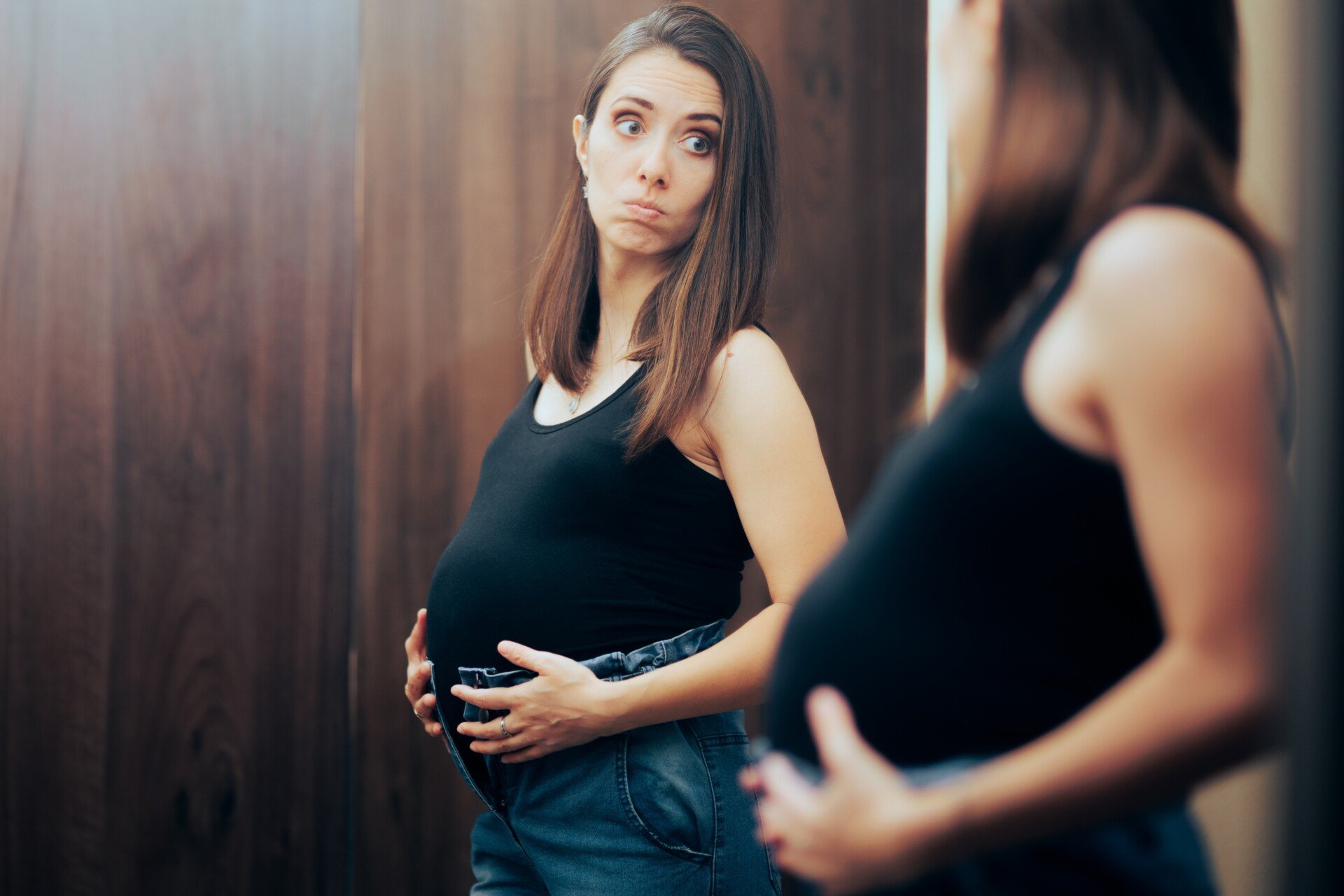Pregnant,Woman,Unable,To,Close,Pants,In,Need,For,Maternity pregnant woman