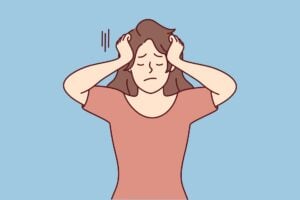 Stressed woman illustration with head in hands